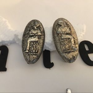 Egyptian styled Silver tones clip on earrings.
